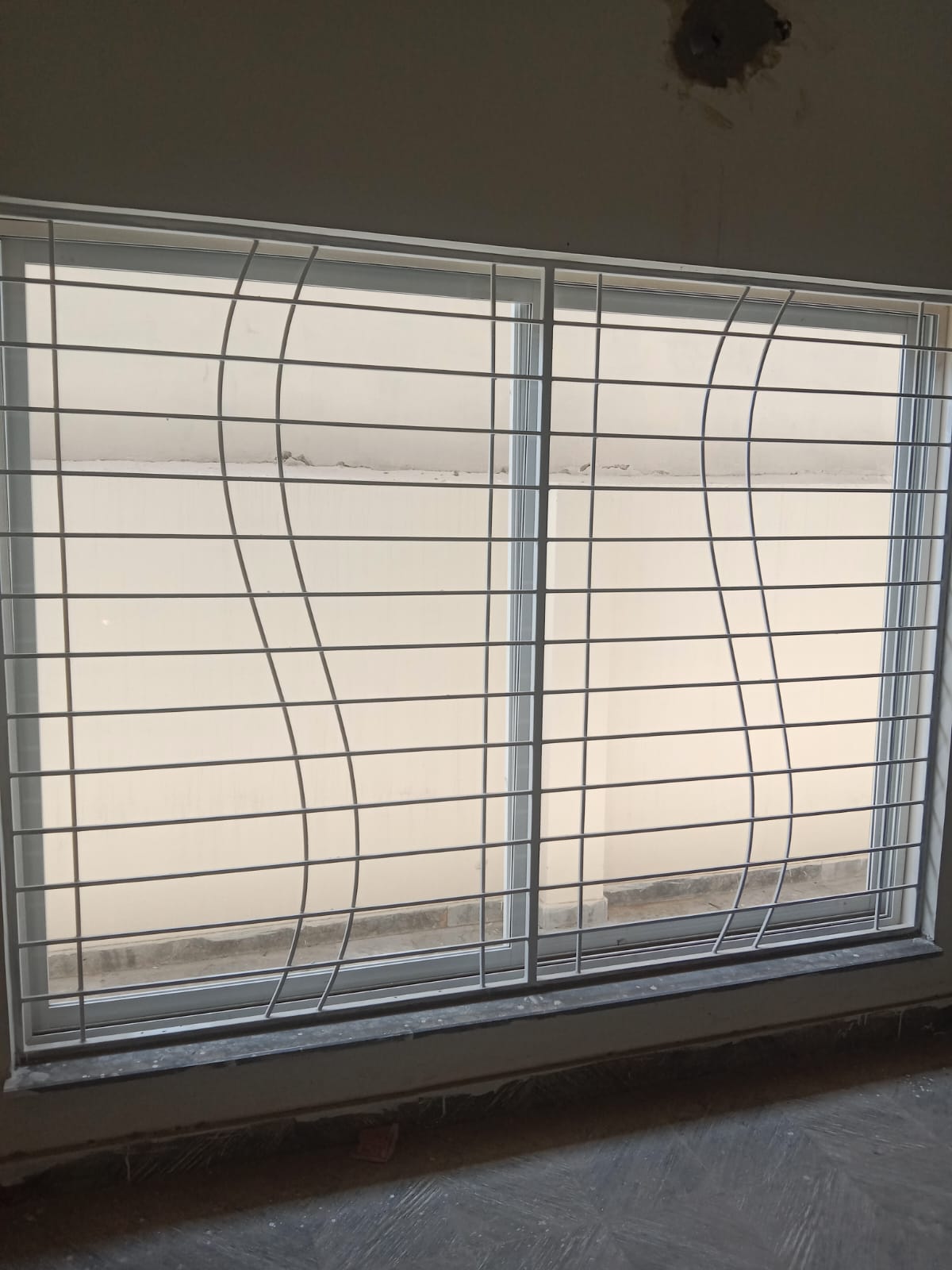 White Curvy Grille Window